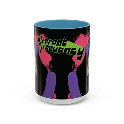 Side of mug with a glossy black exterior and glossy blue interior, and the phrase "different frequency" in bold, stylized neon green and black text. 