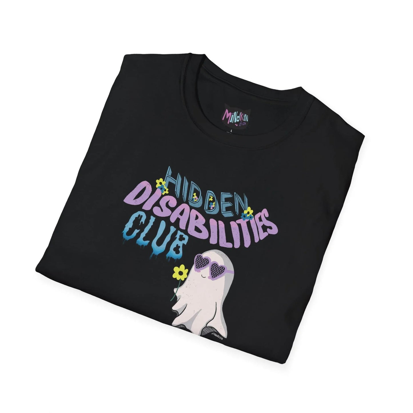 Folded black t-shirt featuring "Hidden Disabilities Club" text with a cute ghost wearing pastel purple sunglasses and holding a flower. Fun and inclusive design.