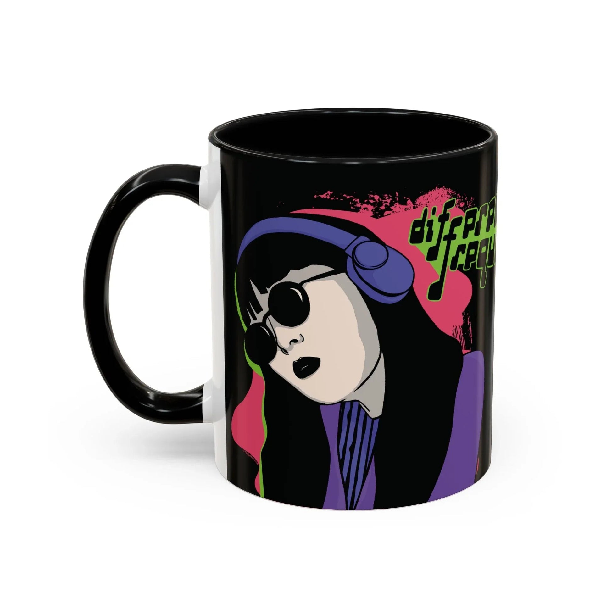 A sleek glossy black mug featuring an illustration of a girl with long dark hair, wearing sunglasses and headphones, neon green text says "different frequency" beside her. The style is grunge and retro.