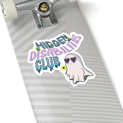 Durable, long-lasting sticker on a skateboard with text "Hidden Disabilities Club" in colorful pastel, playful font, and a smiling ghost wearing sunglasses, holding a yellow flower. Fun and inclusive tone.