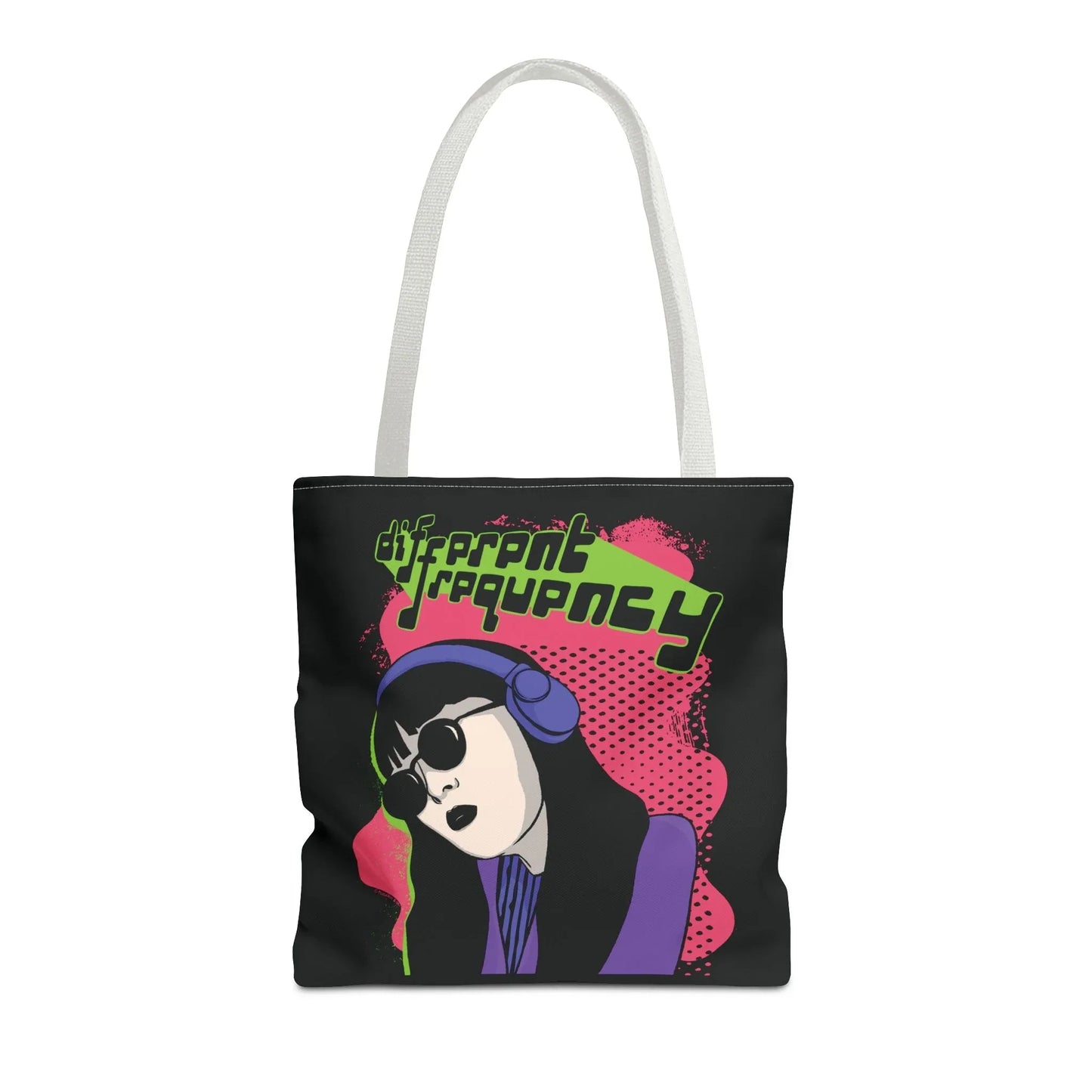 Illustrated white-strapped tote with a stylish person wearing headphones and sunglasses on a pink background. Text reads "different frequency." Retro vibe.