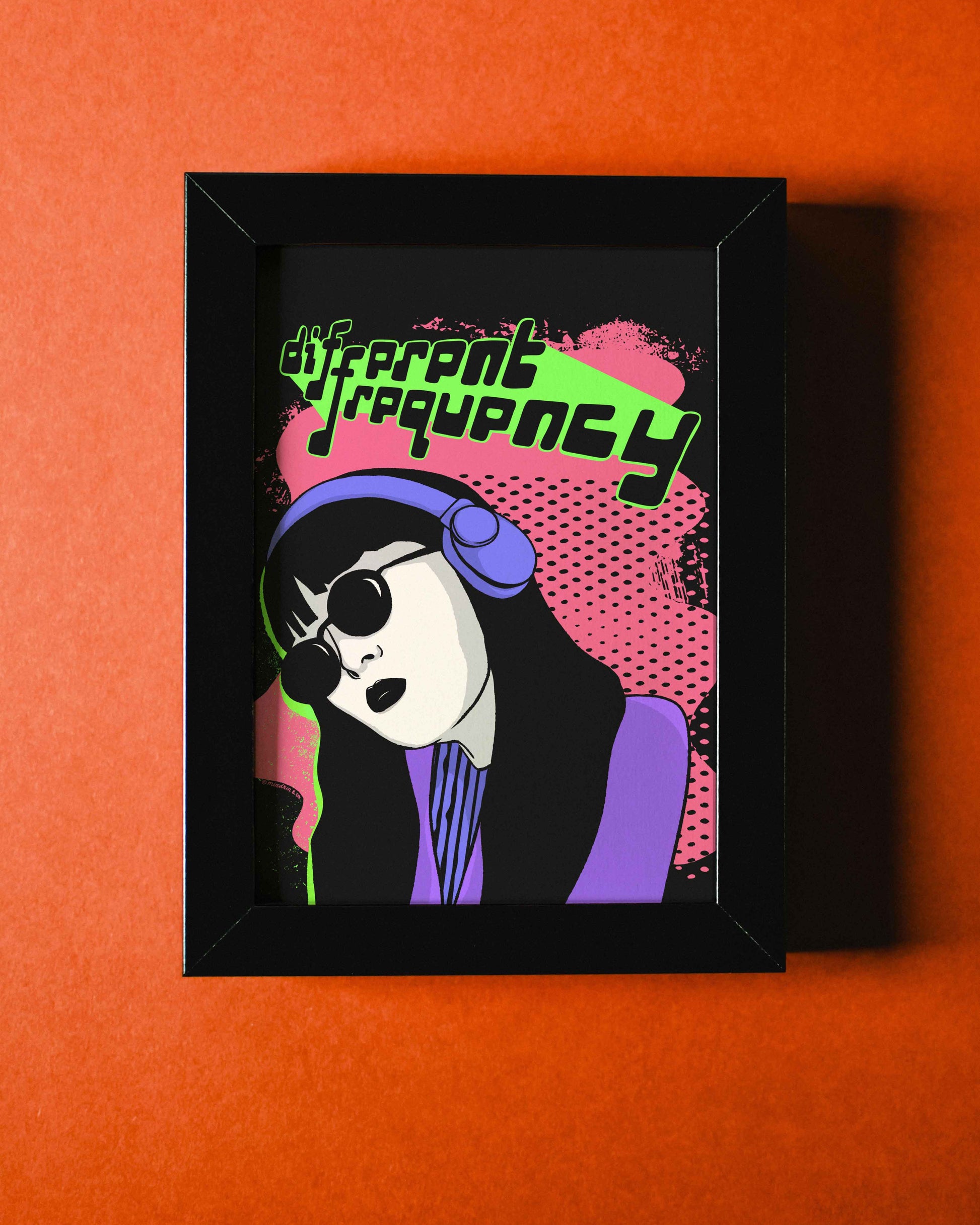 Framed Different Frequency art print on orange background, featuring a pop art style of a person with sunglasses and headphones, text reads "different frequency."