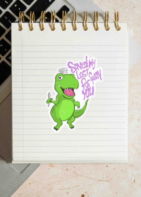 A Saved My Last Spoon For You dino sticker on a notebook page. 
