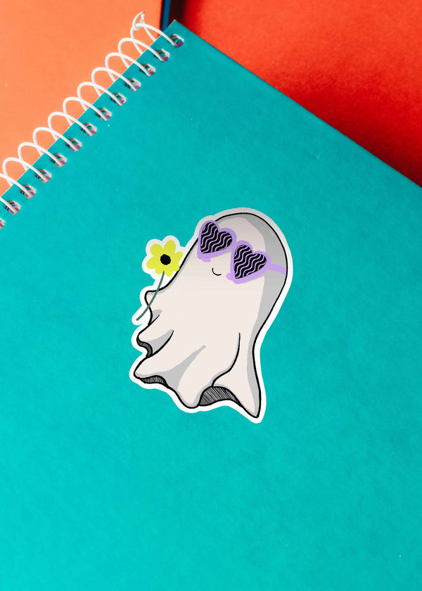 Cute Ghost Hand-Drawn sticker on a teal spiral notebook, evoking a playful, quirky vibe.