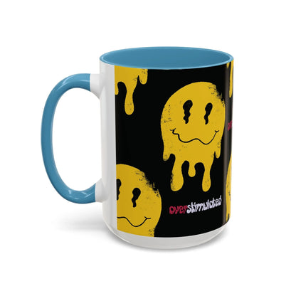 Black 15oz mug with a yellow melting smiley face pattern, evoking a playful, edgy vibe. The word "overstimulated" appears in red and white text, with glossy baby blue handle and interior.