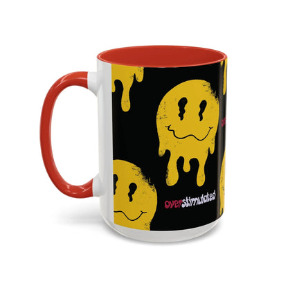 Black 15oz mug with a yellow melting smiley face pattern, evoking a playful, edgy vibe. The word "overstimulated" appears in red and white text, with glossy navy handle and interior.